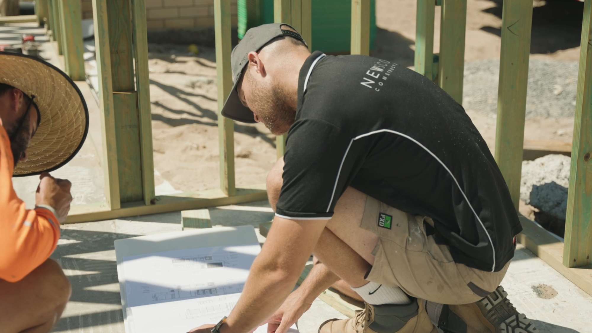 Chris on the plans with a tradesman