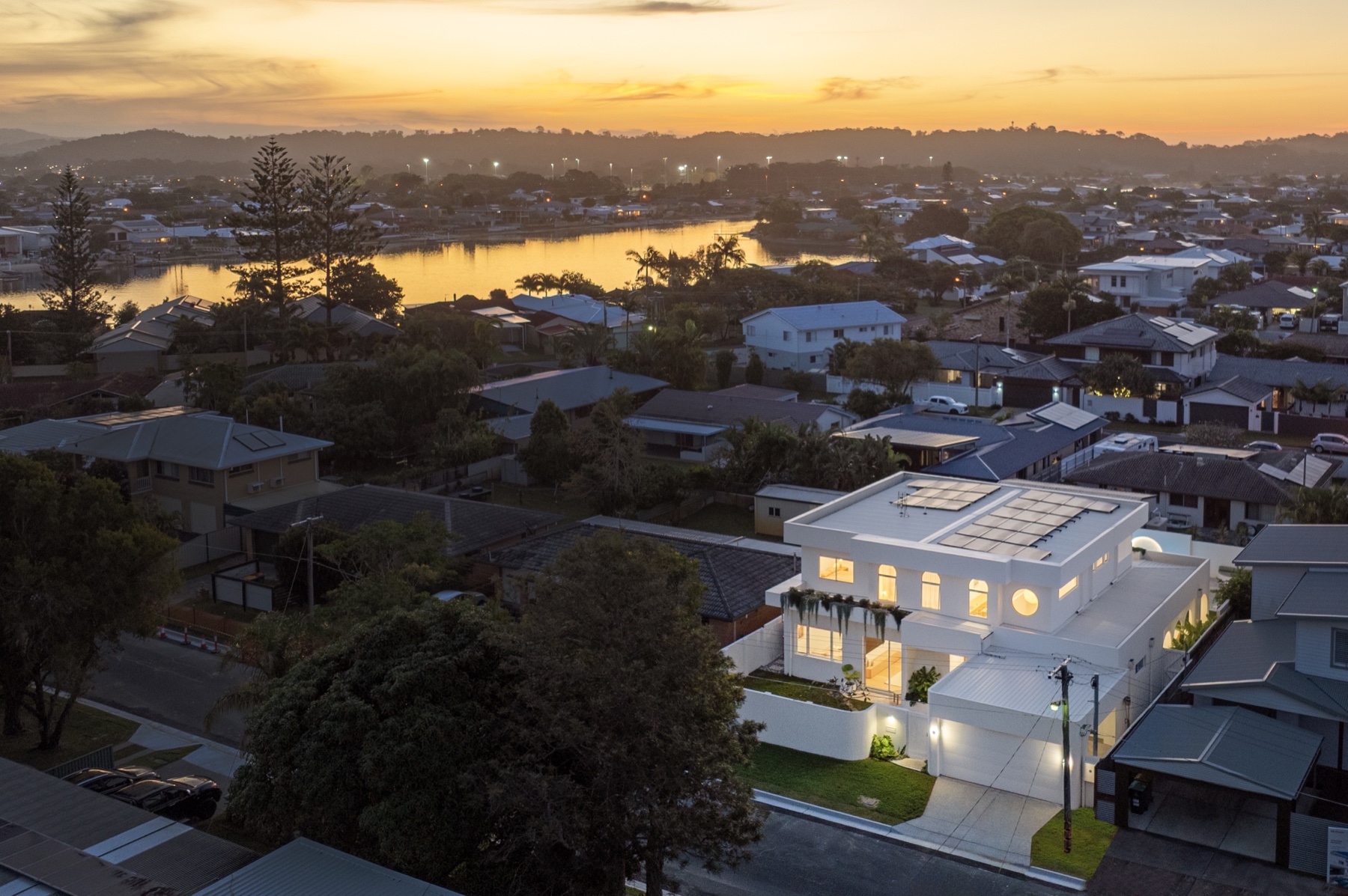 Aerial of 5 Iluka Street at sunset, backing the Palm Beach waterway